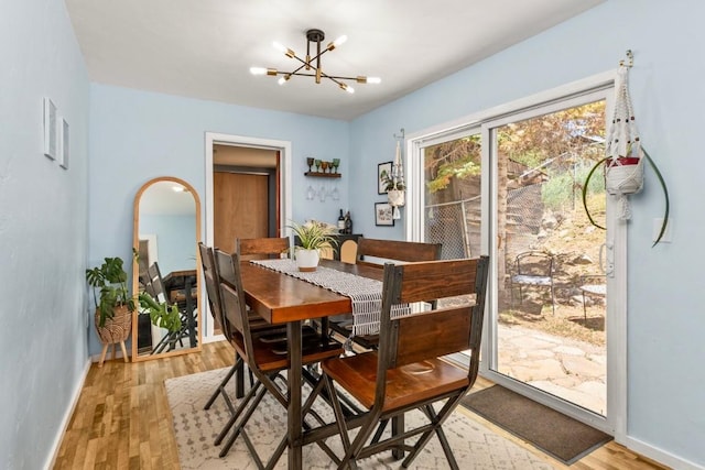 200 N Grant Ave, Oak Creek, CO 80467 - dining room with a chandelier and light wood-type flooring