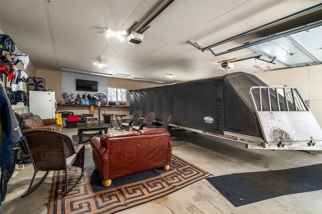 57640 County Road 129, Clark, CO 80428 - garage with freestanding refrigerator and a garage door opener