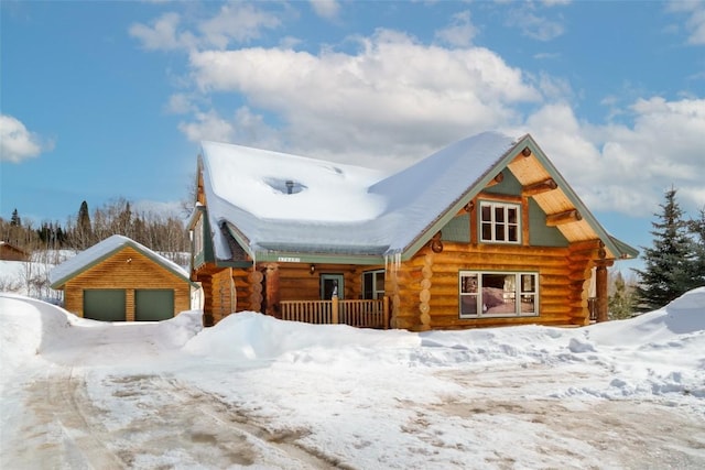 57640 County Road 129, Clark, CO 80428 - log cabin featuring log exterior, a detached garage, covered porch, and an outdoor structure