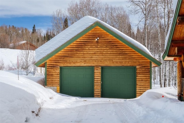 57640 County Road 129, Clark, CO 80428 - snow covered garage featuring a detached garage