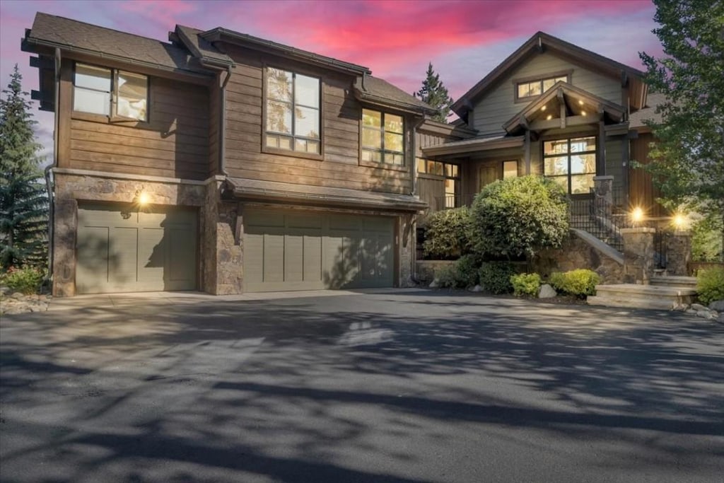 73 Last Chance Ln, Dillon, CO 80435 - view of front of property featuring a garage, driveway, and stone siding