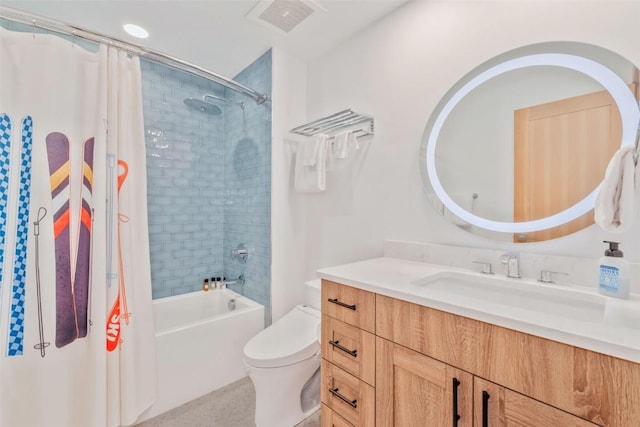 full bathroom featuring vanity, shower / tub combo, and toilet