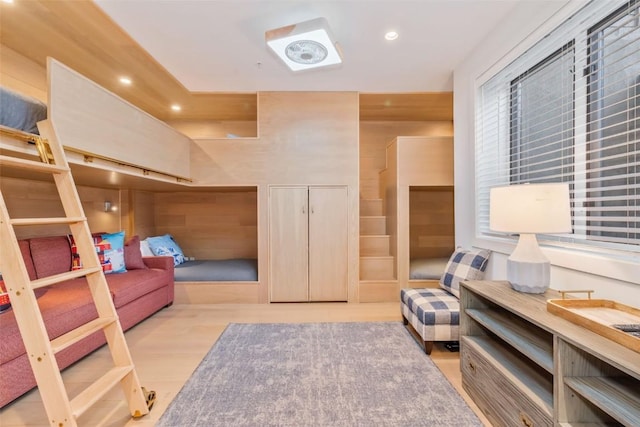 bedroom featuring wooden walls