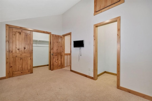 23015 Schussmark Trl Unit C, Oak Creek, CO 80467 - unfurnished bedroom with lofted ceiling, light carpet, and a closet