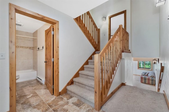 23015 Schussmark Trl Unit C, Oak Creek, CO 80467 - stairs featuring stone finish floors and a baseboard heating unit