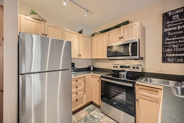 100 Dercum Sq Unit 8343, Keystone, CO 80435 - kitchen with dark countertops, light brown cabinetry, and appliances with stainless steel finishes