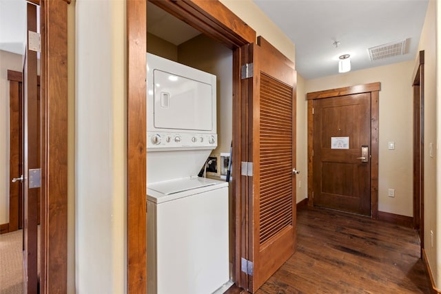 1521 Ski Hill Rd Unit 8313, Breckenridge, CO 80424 - laundry room featuring stacked washing machine and dryer and dark wood-type flooring