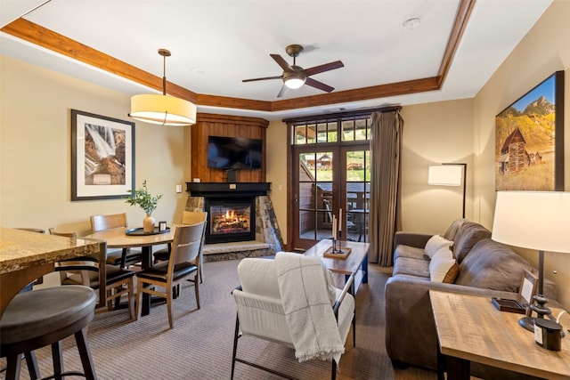 1521 Ski Hill Rd Unit 8313, Breckenridge, CO 80424 - carpeted living room with ceiling fan, a raised ceiling, and a fireplace