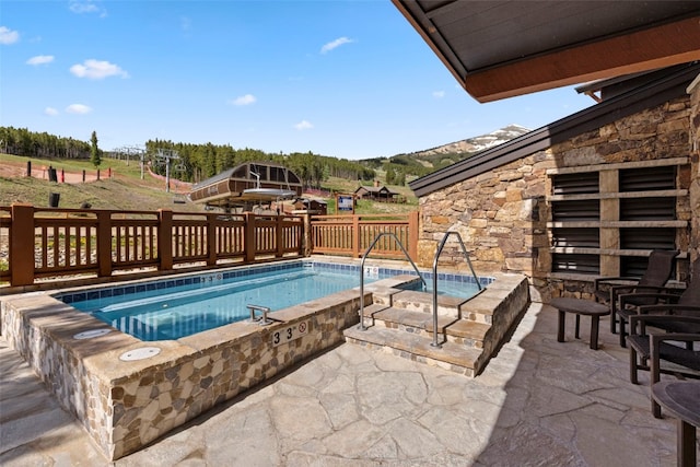 1521 Ski Hill Rd Unit 8313, Breckenridge, CO 80424 - view of swimming pool featuring an in-ground hot tub and a patio