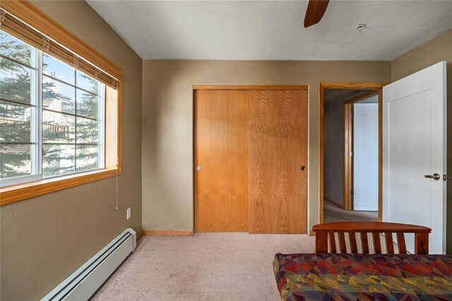 3335 Columbine Dr Unit 907, Steamboat Springs, CO 80487 - carpeted bedroom featuring baseboards, a closet, baseboard heating, and ceiling fan
