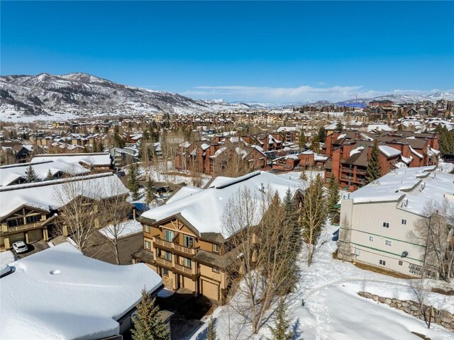 3335 Columbine Dr Unit 907, Steamboat Springs, CO 80487 - snowy aerial view with a mountain view and a residential view