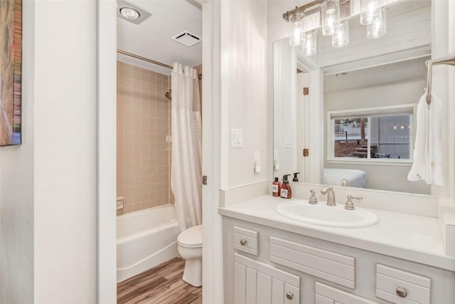 2286 Apres Ski Way Unit 105, Steamboat Springs, CO 80477 - full bathroom with toilet, vanity, shower / tub combo, and wood finished floors