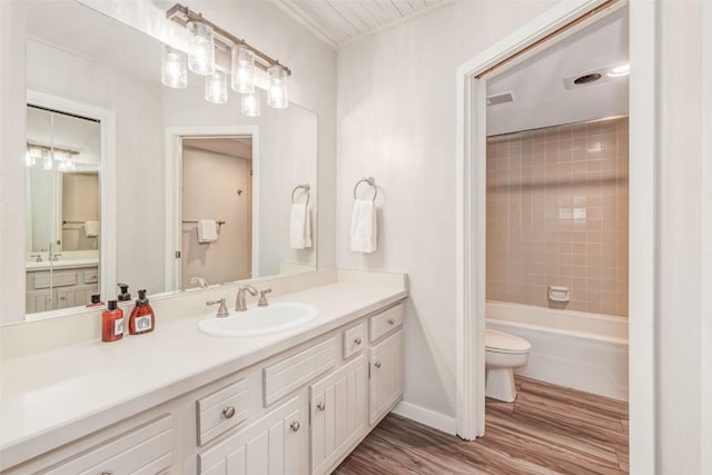 2286 Apres Ski Way Unit 105, Steamboat Springs, CO 80477 - full bathroom with toilet, wood finished floors, vanity, baseboards, and shower / bathtub combination