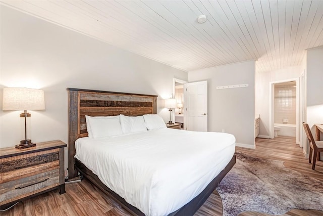 2286 Apres Ski Way Unit 105, Steamboat Springs, CO 80477 - bedroom featuring wooden ceiling, wood finished floors, and baseboards