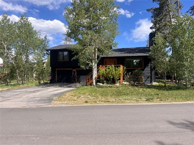 3 Miners Creek Rd, Frisco, CO 80443 - view of front facade featuring driveway, an attached garage, and a front lawn