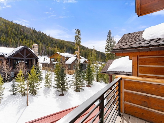 585 Independence Rd, Keystone, CO 80435 - snow covered back of property with a view of trees and a mountain view