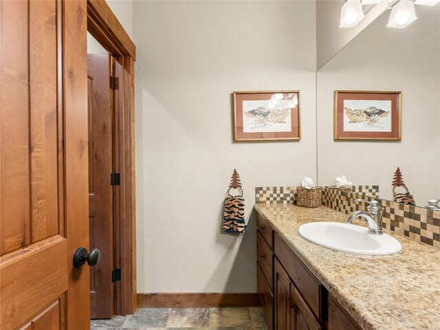 585 Independence Rd, Keystone, CO 80435 - bathroom featuring tasteful backsplash, vanity, and baseboards