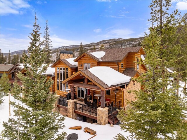 585 Independence Rd, Keystone, CO 80435 - snow covered property featuring a deck with mountain view