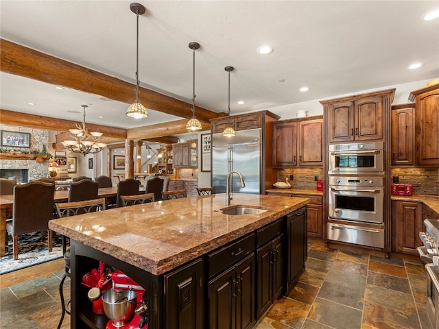 585 Independence Rd, Keystone, CO 80435 - kitchen featuring a warming drawer, a sink, stainless steel appliances, stone tile flooring, and recessed lighting