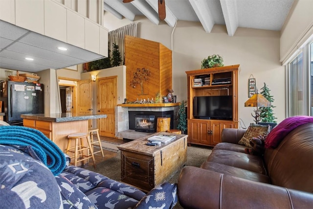 705 Snowberry Ln Unit 303, Breckenridge, CO 80424 - carpeted living area featuring recessed lighting, beam ceiling, and a tile fireplace