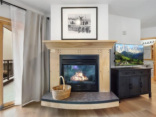 140 Ida Belle Dr Unit 8153, Keystone, CO 80435 - detailed view of wood finished floors and a glass covered fireplace