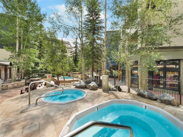 140 Ida Belle Dr Unit 8153, Keystone, CO 80435 - view of swimming pool with a hot tub, a patio area, and a pool