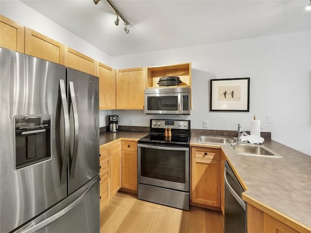 140 Ida Belle Dr Unit 8153, Keystone, CO 80435 - kitchen featuring appliances with stainless steel finishes, light wood-type flooring, rail lighting, light brown cabinetry, and open shelves