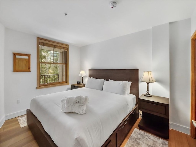 140 Ida Belle Dr Unit 8153, Keystone, CO 80435 - bedroom featuring light wood-style floors and baseboards