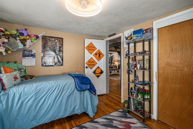 bedroom featuring wood finished floors