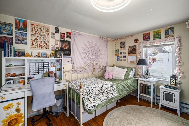 bedroom with wood finished floors