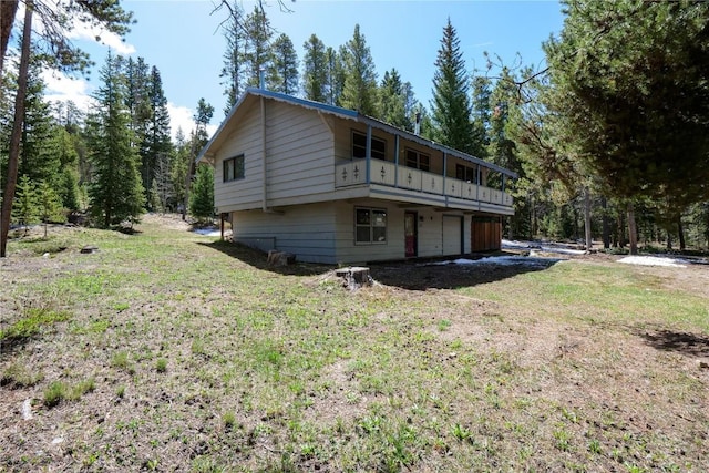 212 Briar Rose Ln, Breckenridge, CO 80424 - view of side of property with an attached garage and a lawn
