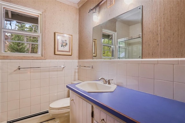 212 Briar Rose Ln, Breckenridge, CO 80424 - bathroom featuring a baseboard radiator, a stall shower, tile walls, crown molding, and toilet