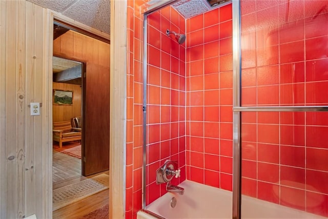 212 Briar Rose Ln, Breckenridge, CO 80424 - bathroom featuring enclosed tub / shower combo, wood finished floors, and wooden walls