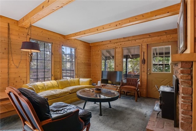 212 Briar Rose Ln, Breckenridge, CO 80424 - living area featuring beam ceiling, wood walls, and carpet floors