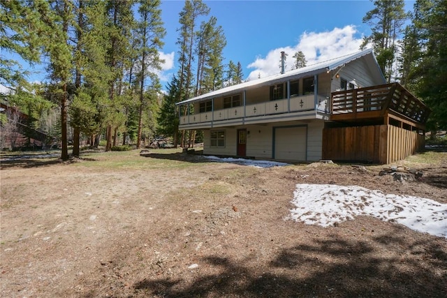212 Briar Rose Ln, Breckenridge, CO 80424 - rear view of property with an attached garage and driveway
