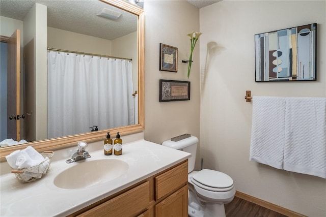 27100 Neptune Pl, Clark, CO 80428 - full bathroom featuring vanity, a textured ceiling, and wood finished floors
