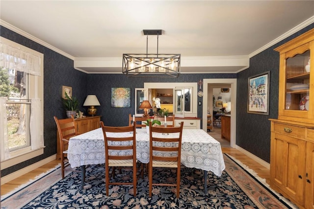102 S High St, Breckenridge, CO 80424 - dining room with wallpapered walls, light wood-style flooring, plenty of natural light, crown molding, and a chandelier