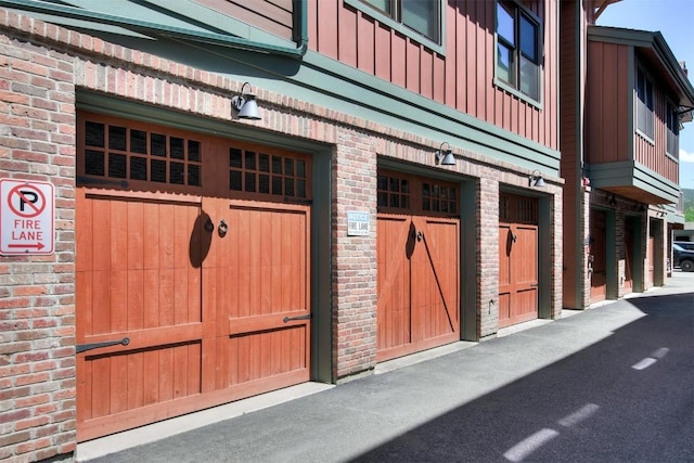 exterior space with brick siding and board and batten siding