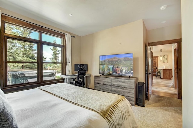 bedroom featuring light colored carpet