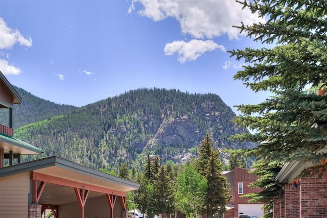 property view of mountains with a wooded view
