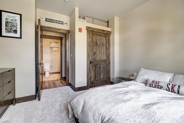 bedroom featuring baseboards and carpet flooring