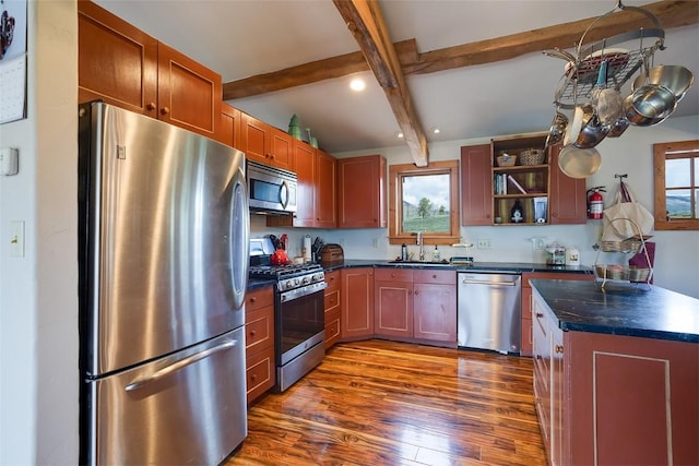 26755 Aspen Ct, Clark, CO 80428 - kitchen with stainless steel appliances, a sink, beam ceiling, dark countertops, and dark wood-type flooring