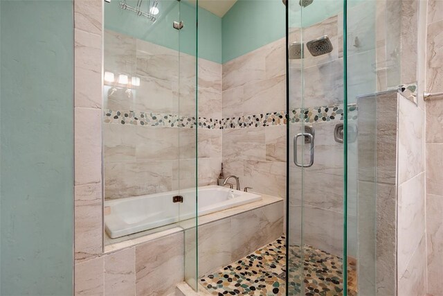 26755 Aspen Ct, Clark, CO 80428 - bathroom featuring a bath, a shower stall, and tile walls