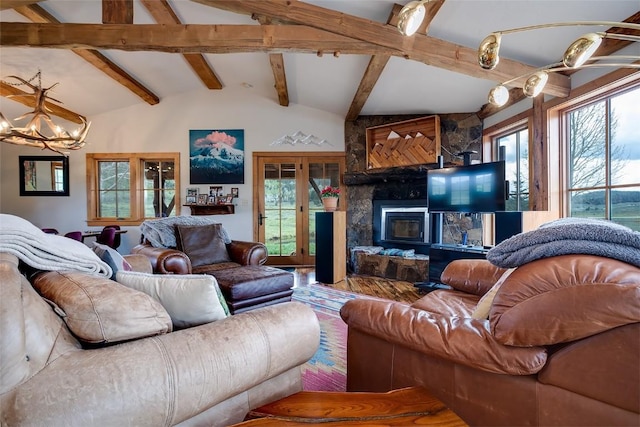 26755 Aspen Ct, Clark, CO 80428 - living room with a stone fireplace, a chandelier, and wood finished floors