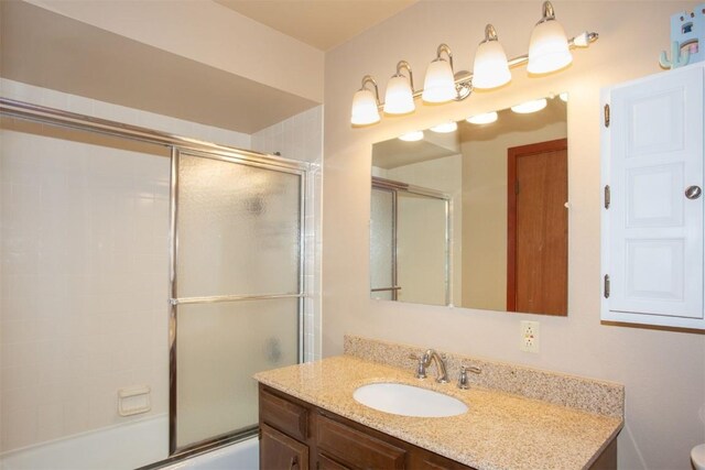 324 W Main St Unit 324, Frisco, CO 80443 - bathroom featuring vanity, shower / bath combination with glass door, and toilet