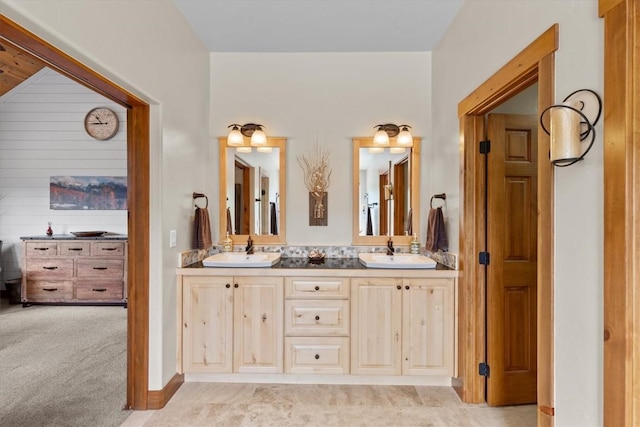 full bath featuring a sink and double vanity