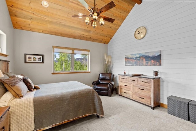 bedroom featuring a ceiling fan, vaulted ceiling, wood walls, wooden ceiling, and light carpet