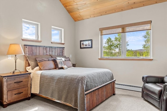 bedroom featuring vaulted ceiling, a baseboard radiator, light carpet, and multiple windows