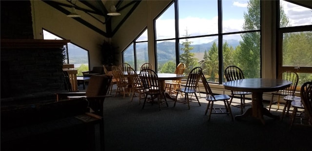 sunroom with plenty of natural light and a mountain view