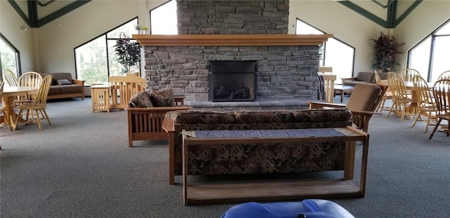 living area with carpet floors, plenty of natural light, and a fireplace